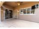 Covered patio area with tile flooring, glass doors and windows, and convenient access to the interior at 14282 W Indianola Ave, Goodyear, AZ 85395
