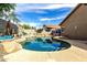 Inviting in-ground pool surrounded by tropical landscaping and a spacious patio, ideal for outdoor enjoyment at 14282 W Indianola Ave, Goodyear, AZ 85395