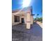 Outdoor patio with a covered ceiling fan, block pillars, and a charming view of the tranquil backyard at 1516 E Azalea Dr, Gilbert, AZ 85298
