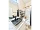 Contemporary bathroom boasting a rectangular sink, marble countertops, and a well-organized shelving unit at 1516 E Azalea Dr, Gilbert, AZ 85298