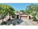 Charming single-story home featuring a well-manicured front yard, desert landscaping, and attached two-car garage at 1516 E Azalea Dr, Gilbert, AZ 85298