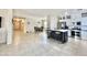 Open-concept living area with a kitchen island, dining space, and seamless flow, perfect for Gathering gatherings and entertaining at 1516 E Azalea Dr, Gilbert, AZ 85298