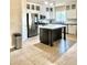 Spacious kitchen with an island, stainless steel appliances, plenty of cabinetry, and modern design perfect for entertaining at 1516 E Azalea Dr, Gilbert, AZ 85298