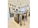 Spacious kitchen featuring a center island with seating, modern appliances, and ample storage space at 1516 E Azalea Dr, Gilbert, AZ 85298