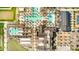 Aerial view of community featuring pools, tennis courts, clubhouse, and walking paths for an active lifestyle at 17168 W Mountainair St, Surprise, AZ 85388
