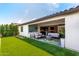 Cozy patio overlooking the pristine turf, adjacent to a gourmet kitchen and indoor living spaces at 17168 W Mountainair St, Surprise, AZ 85388