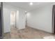 Bright bedroom features a bathroom, neutral decor and tile floors at 17168 W Mountainair St, Surprise, AZ 85388