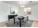 Well-lit dining room featuring contemporary decor, a sleek table, and stylish seating at 17168 W Mountainair St, Surprise, AZ 85388