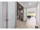 Hallway shows the open floor plan leading to a living room with doors to another room at 17168 W Mountainair St, Surprise, AZ 85388