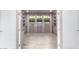 Bright office features built-in shelving, three windows with privacy shades, and tile flooring at 17168 W Mountainair St, Surprise, AZ 85388