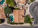 Aerial view of a home with a private pool, lush landscaping, and an outdoor fire pit in a well-maintained neighborhood at 1754 W San Tan St, Chandler, AZ 85224