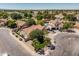 Neighborhood view with mature landscaping, lush green lawns, and tile roofs at 1754 W San Tan St, Chandler, AZ 85224
