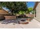 Backyard featuring an outdoor kitchen, seating, and a cozy fire pit at 1754 W San Tan St, Chandler, AZ 85224