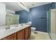 Bathroom featuring double sinks, walk-in shower and blue walls at 1754 W San Tan St, Chandler, AZ 85224