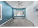 A bedroom that has laminated wood flooring, ceiling fan, and windows at 1754 W San Tan St, Chandler, AZ 85224