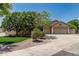 Charming single-story home featuring a well-manicured lawn, mature trees, and a spacious three-car garage at 1754 W San Tan St, Chandler, AZ 85224