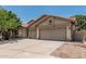 Well-maintained home with a three-car garage, tile roof, desert landscaping, and a spacious driveway at 1754 W San Tan St, Chandler, AZ 85224