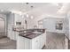 Kitchen island with granite counters and pendant lighting, open to the dining area at 1754 W San Tan St, Chandler, AZ 85224