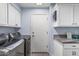 Laundry room featuring updated appliances and ample storage at 1754 W San Tan St, Chandler, AZ 85224