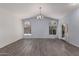 Bright living room with vaulted ceiling, chandelier, and luxury vinyl plank flooring at 1754 W San Tan St, Chandler, AZ 85224