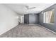 Spacious living room featuring soft gray carpeting and natural light at 1754 W San Tan St, Chandler, AZ 85224