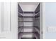 Walk-in pantry with built-in shelving for optimal storage and organization at 1754 W San Tan St, Chandler, AZ 85224