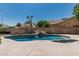 Inviting pool with rock waterfall feature for a relaxing outdoor oasis at 1754 W San Tan St, Chandler, AZ 85224