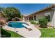 Lovely backyard with a pool, diving board, and lush greenery at 1754 W San Tan St, Chandler, AZ 85224