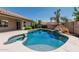 Beautiful backyard pool featuring a tranquil rock waterfall at 1754 W San Tan St, Chandler, AZ 85224