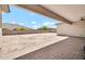 Covered back patio with brick pavers, offering a serene space for outdoor enjoyment at 18225 W San Juan Ct, Litchfield Park, AZ 85340