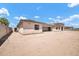 Expansive backyard with a perimeter wall, offering privacy and plenty of space for outdoor activities at 18225 W San Juan Ct, Litchfield Park, AZ 85340