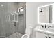 Modern bathroom featuring a glass shower, and illuminated mirror above a vanity at 18225 W San Juan Ct, Litchfield Park, AZ 85340