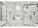 Bright bathroom featuring a soaking tub and separate glass-enclosed shower with marble surround at 18225 W San Juan Ct, Litchfield Park, AZ 85340
