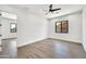 Spacious bedroom with light wood floors and windows providing ample natural light at 18225 W San Juan Ct, Litchfield Park, AZ 85340