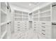 Walk-in closet features custom shelving, built-in drawers, and ample storage space at 18225 W San Juan Ct, Litchfield Park, AZ 85340