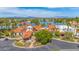 Expansive aerial view of lakefront property, showcasing lush landscaping and stunning architectural details at 1835 E Marquette Dr, Gilbert, AZ 85234