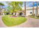 Exterior shot of a charming clubhouse featuring landscaped grounds and elegant entryway at 1835 E Marquette Dr, Gilbert, AZ 85234