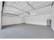 Spacious garage featuring ample room for parking and storage, with a modern water heater and neutral paint at 1835 E Marquette Dr, Gilbert, AZ 85234