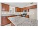 Well-equipped kitchen with granite countertops, stainless steel appliances, and a functional island at 1835 E Marquette Dr, Gilbert, AZ 85234
