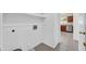 Interior laundry room with utility sink hookups and doorway into the kitchen at 1835 E Marquette Dr, Gilbert, AZ 85234