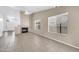 Inviting living room featuring tile floors, fireplace, and lots of natural light at 1835 E Marquette Dr, Gilbert, AZ 85234