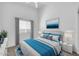 Serene main bedroom features modern decor, soft lighting and a window for natural light at 1835 E Marquette Dr, Gilbert, AZ 85234