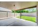 Covered patio overlooking a grassy yard and block fence for privacy at 1835 E Marquette Dr, Gilbert, AZ 85234