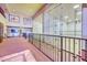 Upper-level view of well-maintained racquetball courts with viewing area, perfect for sports and recreation at 1835 E Marquette Dr, Gilbert, AZ 85234