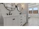 Elegant bathroom featuring dual sinks, modern fixtures, and ample counter space at 20326 W Roma Ave, Buckeye, AZ 85396