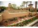 Landscaped Verrado Golf Club entrance sign with elegant architecture and desert flora at 20326 W Roma Ave, Buckeye, AZ 85396