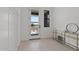 Bright entry features a modern door with glass panes and stylish console table at 20326 W Roma Ave, Buckeye, AZ 85396