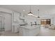 Open-concept kitchen features a large island, modern appliances, and ample natural light at 20326 W Roma Ave, Buckeye, AZ 85396