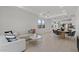 Spacious living room with an open layout showcasing the dining area and modern kitchen at 20326 W Roma Ave, Buckeye, AZ 85396