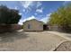 Back exterior featuring a covered patio and a view of desert landscaping and privacy walls at 2042 N Parish N Ln, Casa Grande, AZ 85122